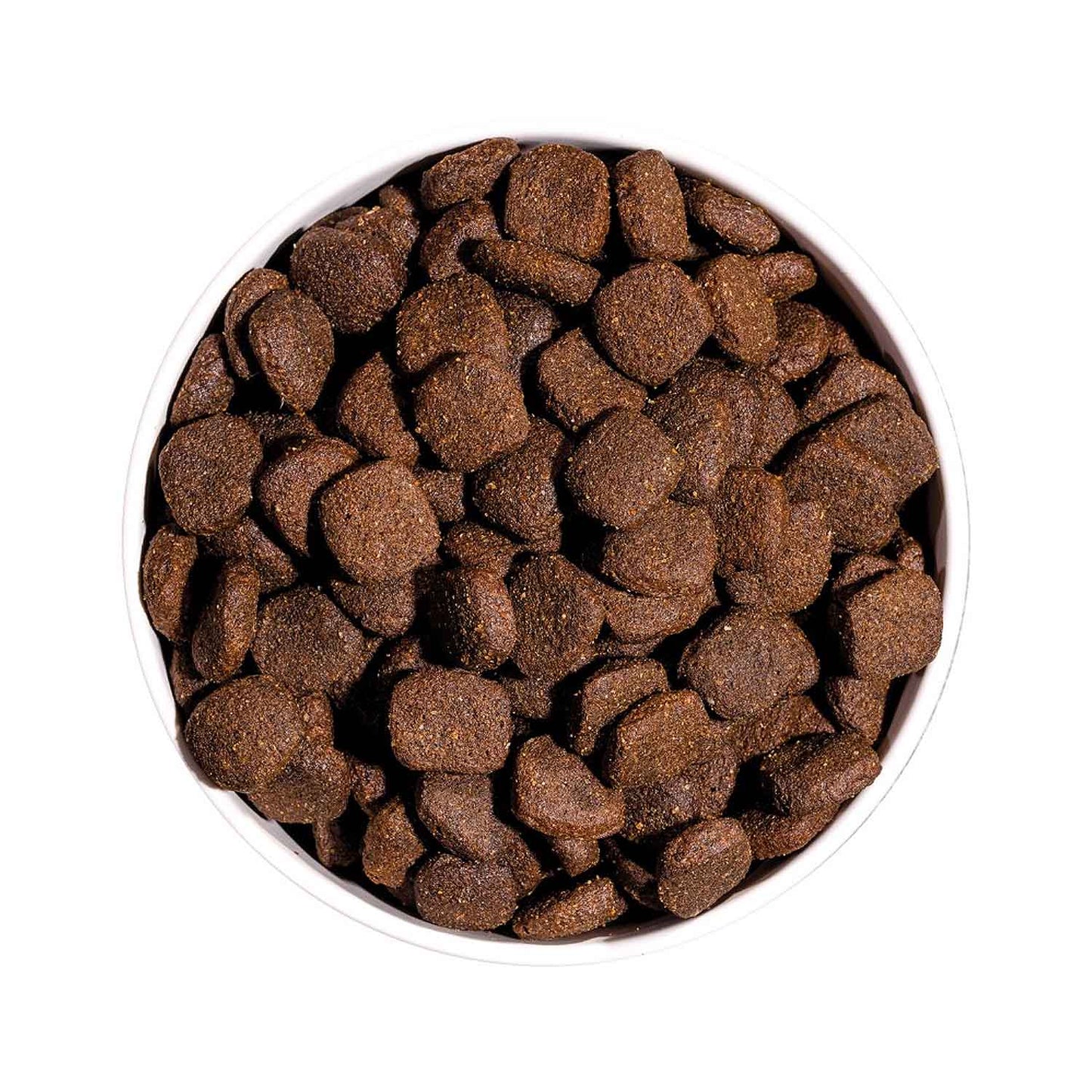 Vista superior de un cuenco lleno de croquetas del pienso Ownat Grain Free Prime Adult Chicken & Turkey, alimento seco natural para perros adultos sin cereales.
