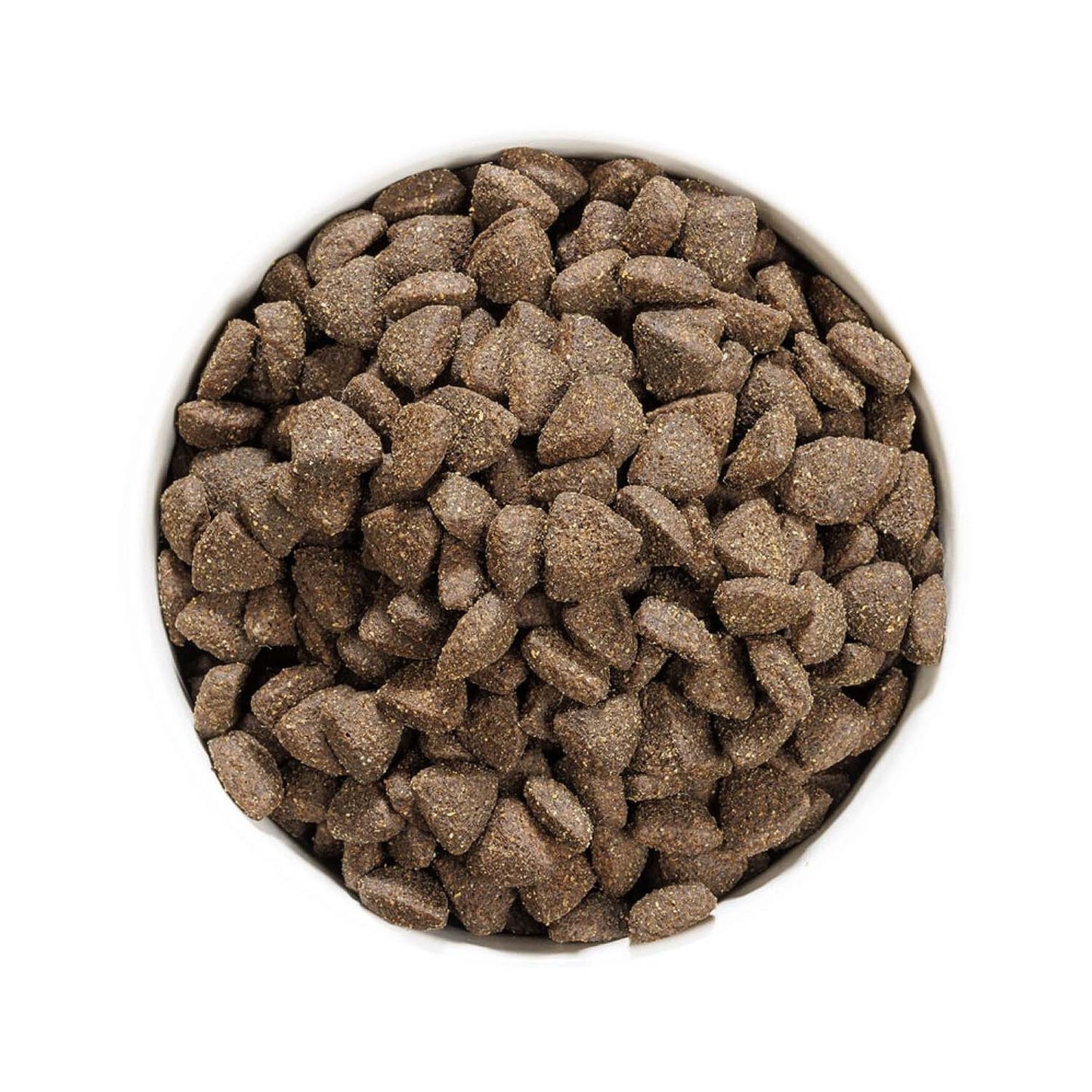 Vista superior de un cuenco lleno de croquetas del pienso Ownat Grain Free Prime Adult Lamb, alimento seco natural para perros adultos sin cereales.