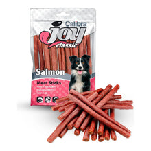 Palitos Calibra Joy de salmón para perros, bolsa Joy Classic con un border collie