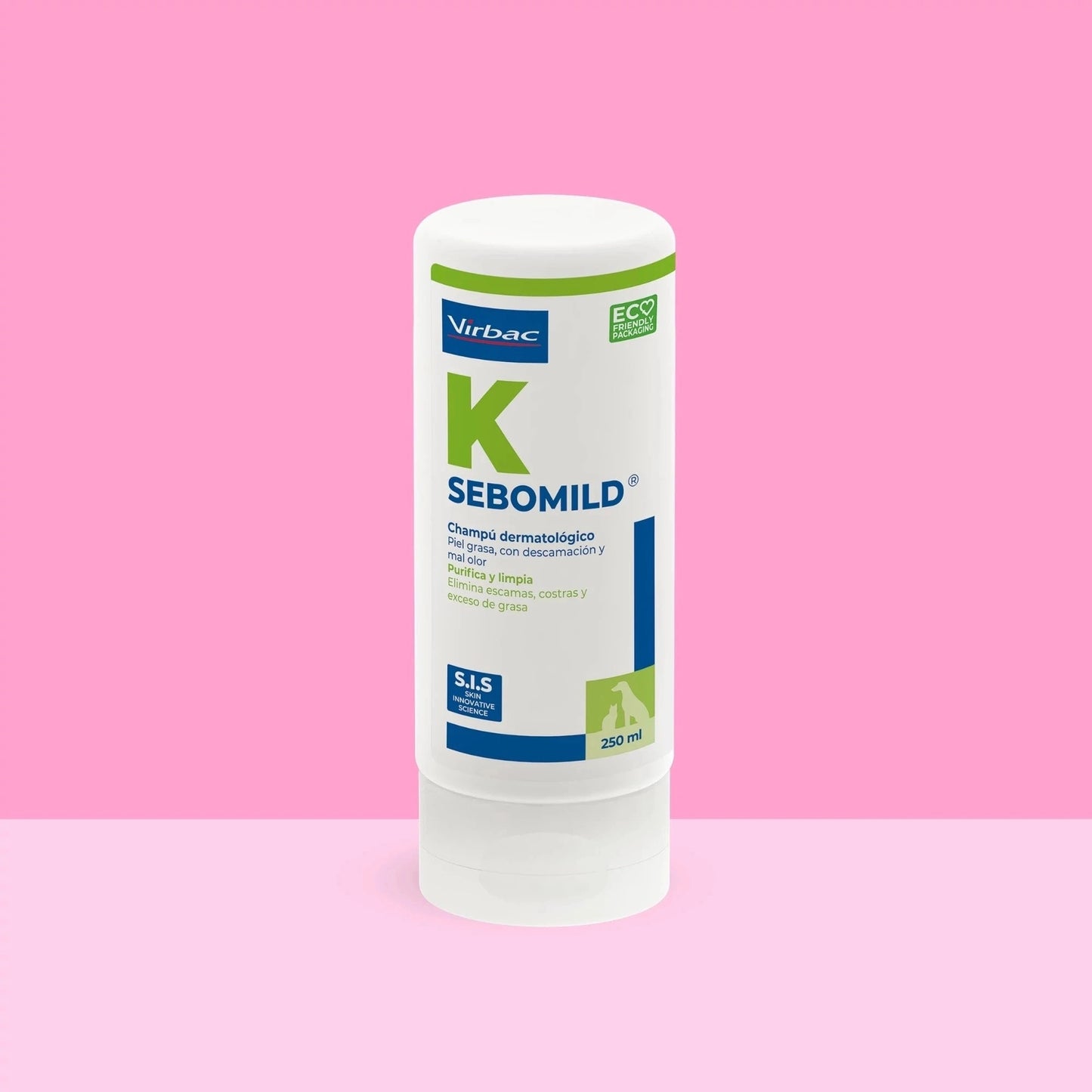 Bote Sebomild K Virbac champú dermatológico 250 ml sobre fondo rosa vibrante, etiqueta blanca y azul con letra K verde, texto Piel grasa con descamación y mal olor, purifica y limpia, elimina escamas costras y exceso de grasa, sellos SIS y ECO FRIENDLY PACKAGING